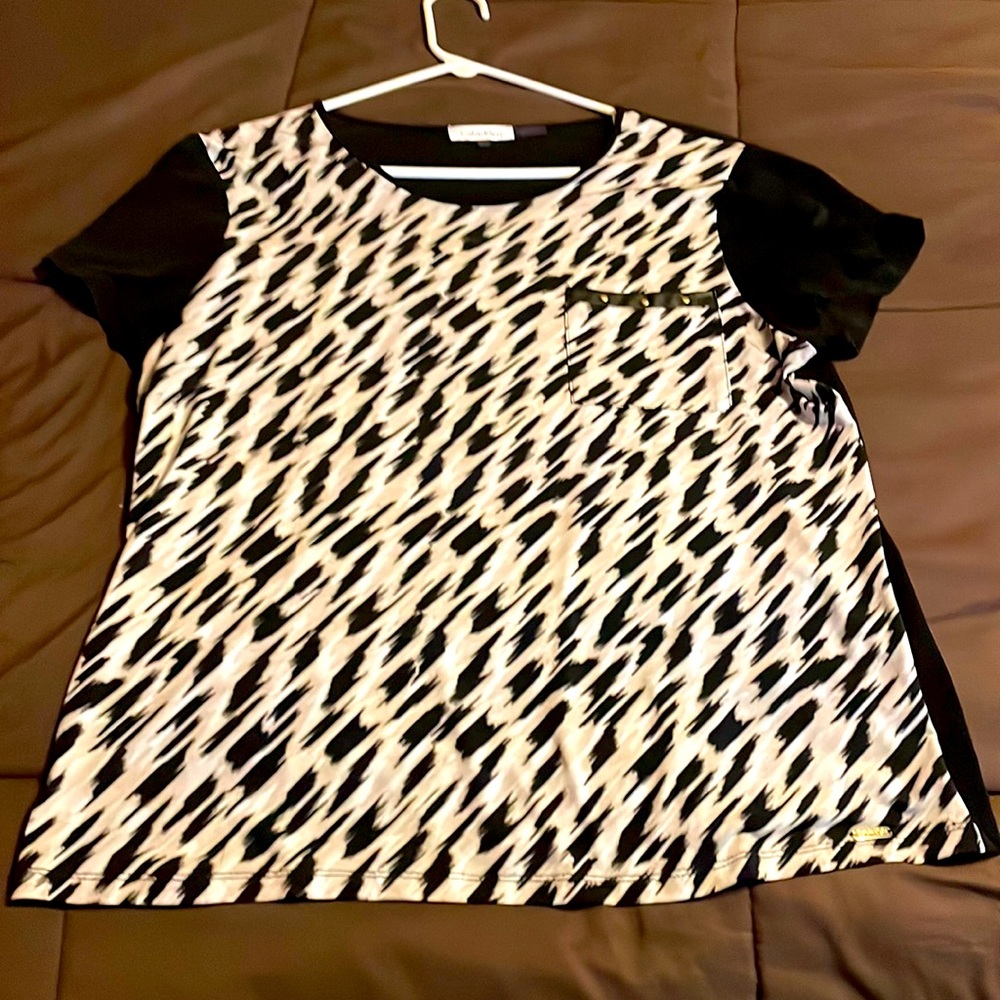 Calvin Kline short sleeve blouse with leather pocket detail.